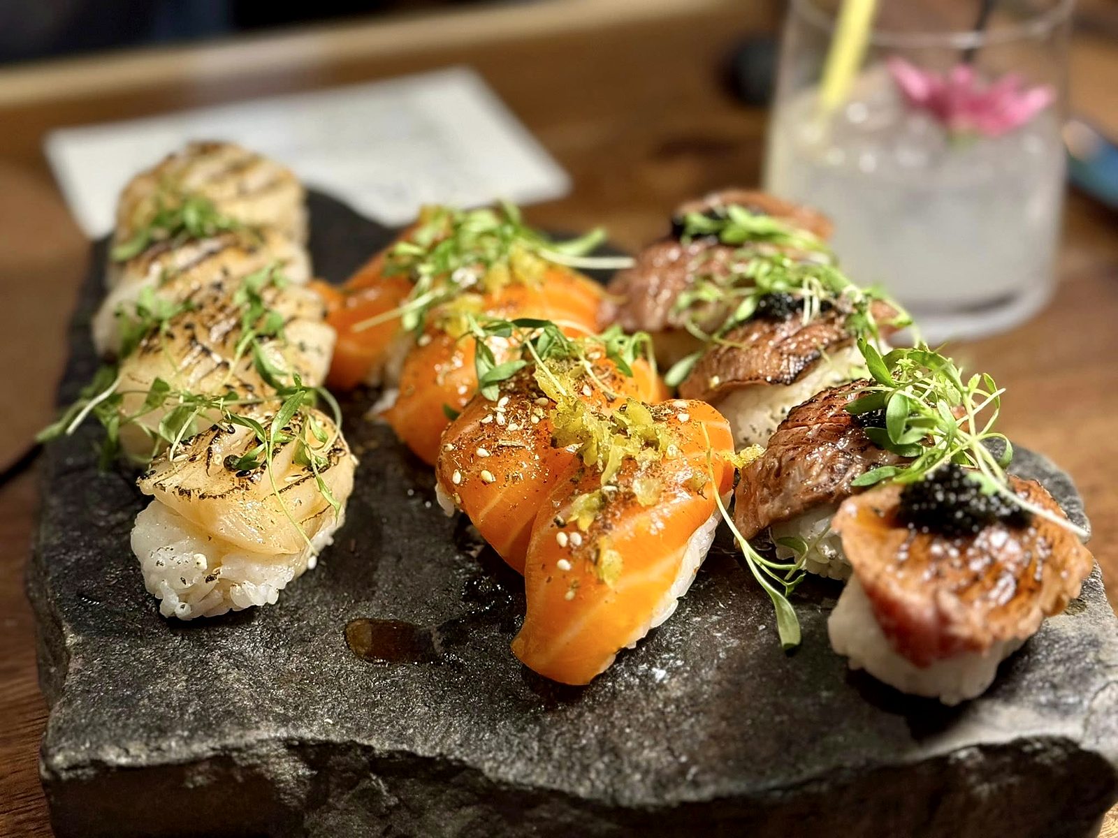 Nigiri at Noka — rows of seared scallop, torched salmon, and seared beef topped with black tobiko.