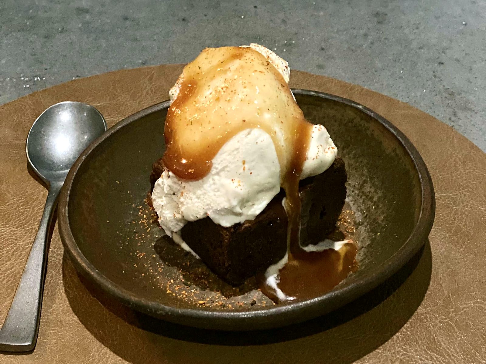 The togarashi brownie at Noka — under ice cream and caramel, dusted with red togarashi.
