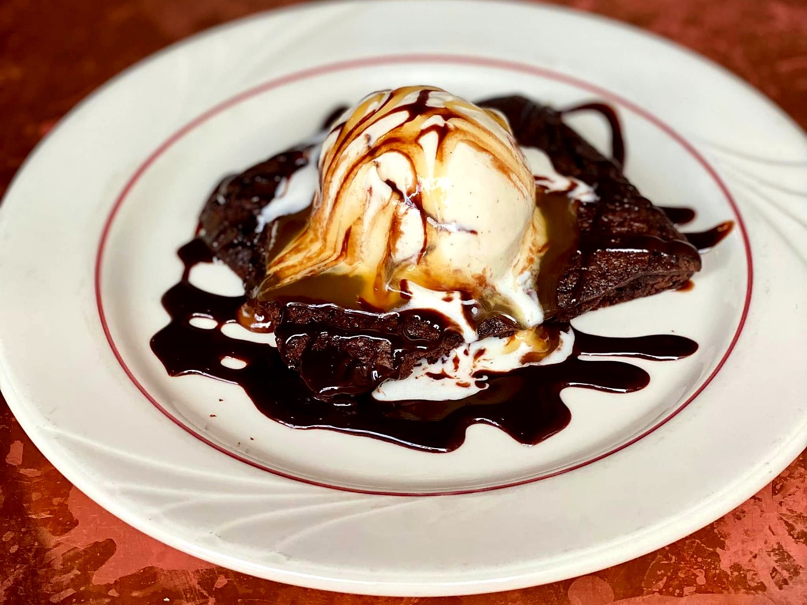 The brownie at CO. Ranch House — warm, under vanilla ice cream, chocolate sauce, and caramel.