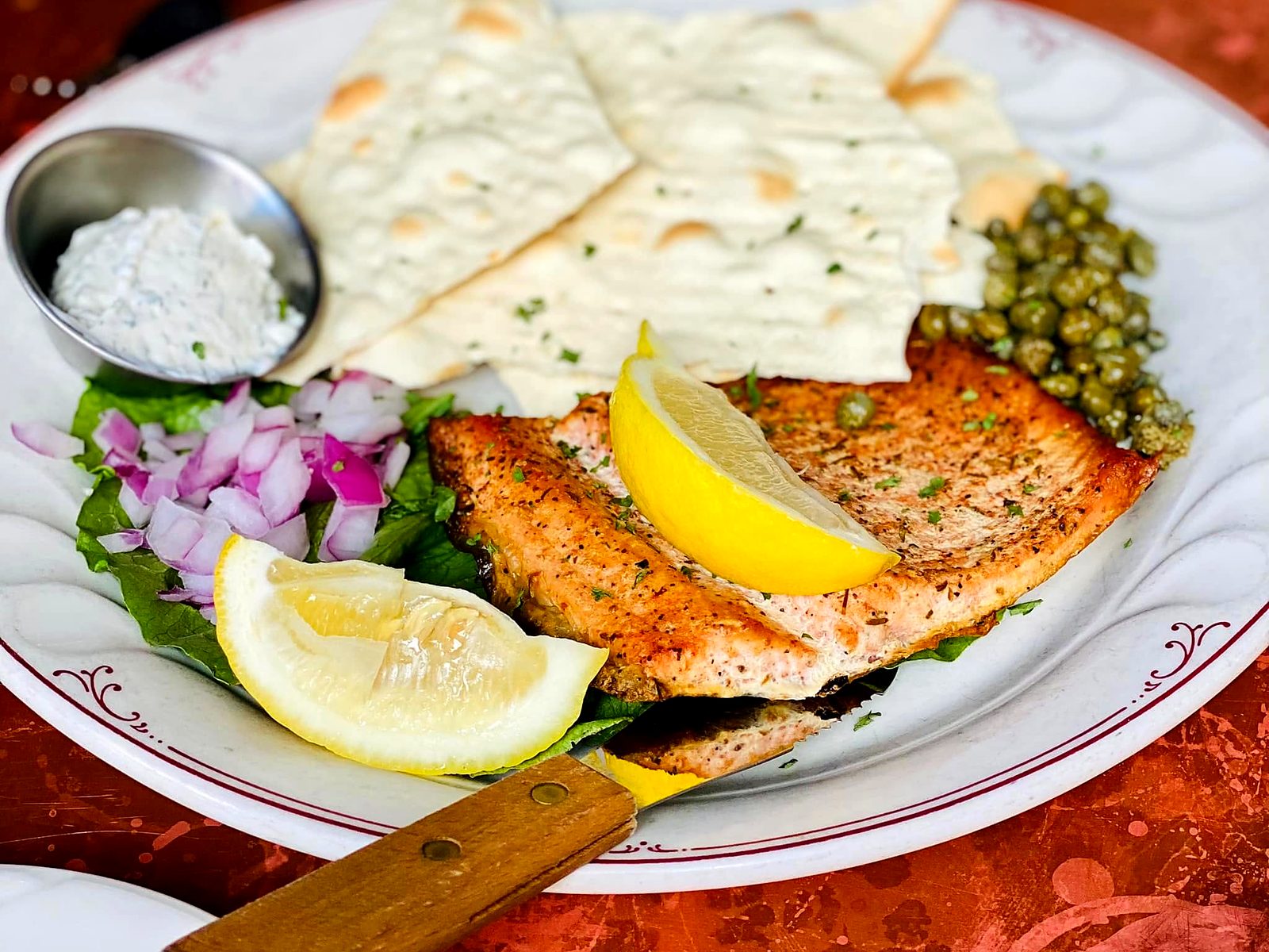House-smoked trout at CO. Ranch House — a chilled fillet with capers, red onion, dill-horseradish sauce, and lavosh crackers.
