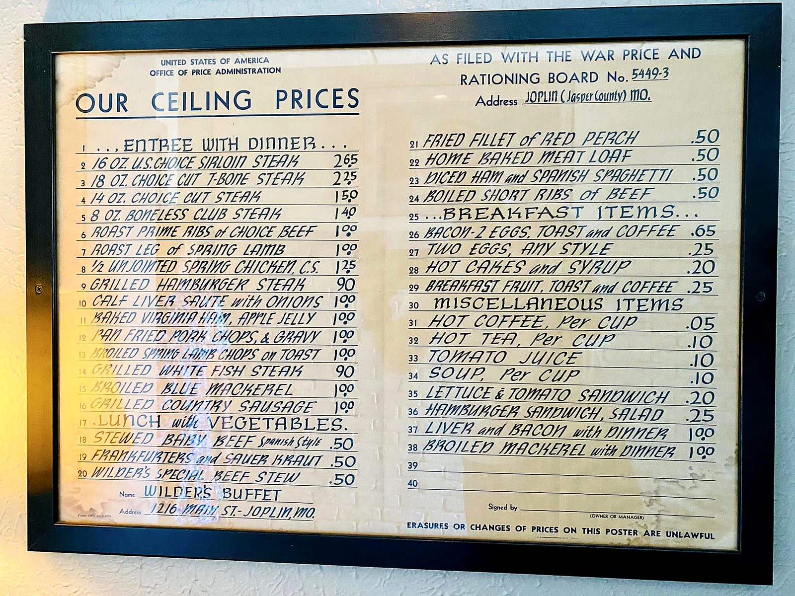 The framed wartime price list on the wall at Wilder’s — “Our Ceiling Prices,” filed with the War Price and Rationing Board by Wilder’s Buffet, 1216 Main St., Joplin: a 16-ounce sirloin for $2.65, hot coffee a nickel.